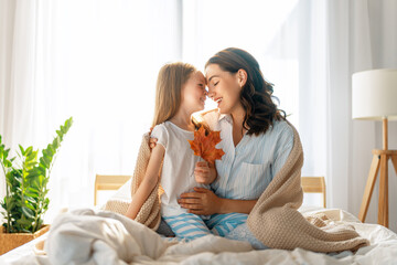 Canvas Print - girl and mother enjoying sunny morning