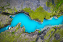 Blue Lake Surrounded By Rocky Shores