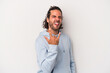 © Asier - Young caucasian man isolated on gray background showing rock gesture with fingers