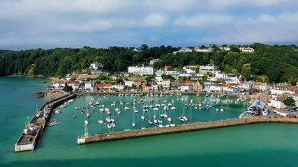 Wall Mural - Aerial video of St Aubin's Harbour at high tide with St Aubin's village in the background, Jersey, Channel Islands