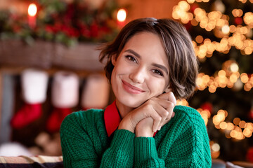 Wall Mural - Photo of cute millennial brunette lady hands head wear green sweater at home on holiday