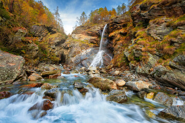 Wall Mural - Beautiful autumn landscape with yellow trees and waterfall