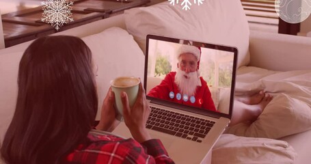 Poster - Animation of snow falling over mixed race woman on laptop video call with santa at christmas