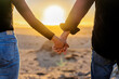 © freechoice - couple holding hands together at sunset