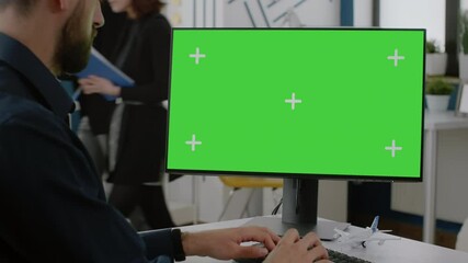 Poster - close up of man typing on keyboard with green screen on monitor. business entrepreneur using compute
