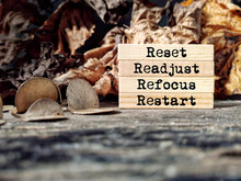 Inspirational And Motivational Concept - Reset Readjust Refocus Restart Text Background. Stock Photo.