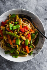 Wall Mural - vegan mixed vegetables stir fry with udon noodles, healthy plant-based food