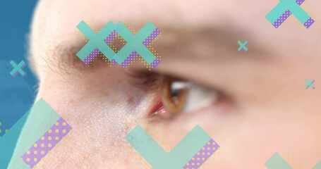 Poster - Animation of cross icons over eye of caucasian man on blue background