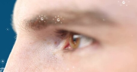Poster - Animation of icons over eye of caucasian man on blue background