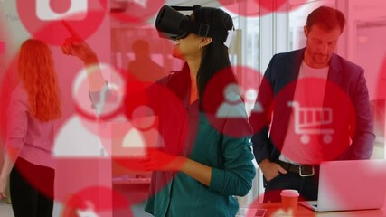 Poster - Animation of social media icons over diverse colleagues and mixed race woman wearing vr headset