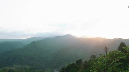 Wall Mural - pan shot of mountains with forest.