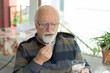 © Yasin - bald old man with glasses taking his daily meds. Selective Focus Man