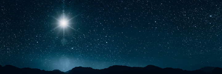 the star shines over the manger of christmas of jesus christ.