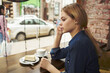 © SHOTPRIME STUDIO - woman a cup of coffee in a cafe pensive look