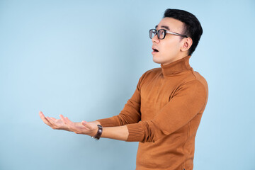 Sticker - Asian man posing on blue background