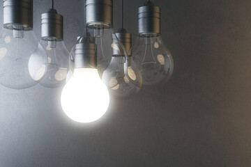 Aufkleber - Glowing light bulb on blurry concrete wall background. Idea, innovation, solution and invention concept. Mock up, 3D Rendering.