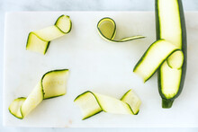 Zucchini, Courgette Ribbons And Zucchini, Courgette On Marble Board
