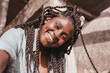 © olezzo - Portrait of beautiful young happy smiling african woman with pigtails, close up head shot