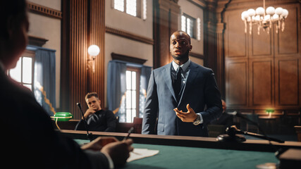 Wall Mural - Court of Justice and Law Trial: Male Public Defender Presenting Case, Making Passionate Speech to Judge, Jury. African American Attorney Lawyer Protecting Client's Innocents with Supporting Argument.