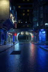 Wall Mural - Dark and moody urban street view in a futuristic city at night, realistic 3D rendering in portrait format with copy space.