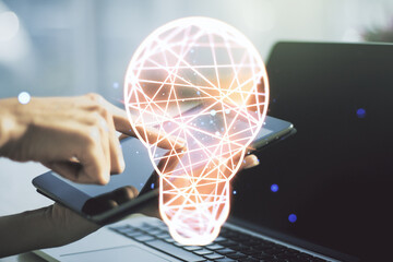 Poster - Double exposure of creative light bulb hologram with finger clicks on a digital tablet on background, research and development concept