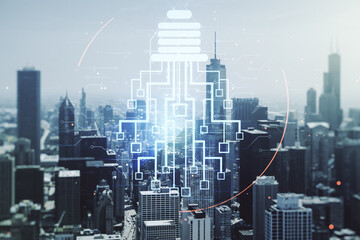 Poster - Double exposure of virtual creative light bulb hologram with chip on Chicago city skyscrapers background, idea and brainstorming concept