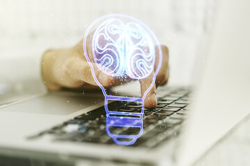 Poster - Double exposure of creative light bulb hologram with human brain and with hands typing on laptop on background, idea and brainstorming concept