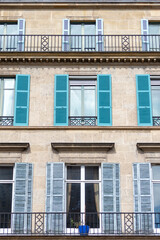 Typical architectural features of parisian buildings. Stone repetitive facade with blu zinc plates roof