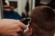 © Minet - Young Man in Barbershop Hair Care Service Concept. Selective focus