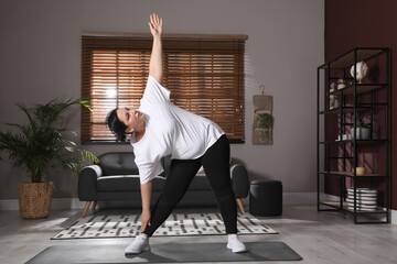 Sticker - Overweight mature woman doing exercise at home