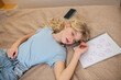 © zinkevych - A cute blonde girl napping and looking peaceful