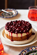 © Lyutik_Ryutik - Cherry cake. Breton shortcrust pastry. Cheesecake. Cherry sauce. Side view. Wooden background.