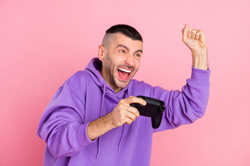 Poster - Photo of hooray millennial brunet guy playstation wear violet hoodie isolated on pink background