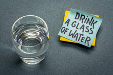 Drink A Glass Of Water - Hydration Reminder, Handwriting On Blue Sticky Note