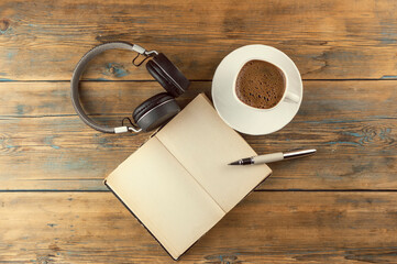 Wall Mural - Open a blank page book, pen and cup of coffee on the desk