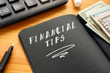 Financial concept about FINANCIAL TIPS with inscription on the sheet.