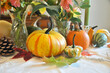 Fall harvest pumpkin and gourds arranged for beautiful seasonal table decor for family Thanksgiving dinner or autumn wedding.