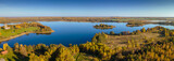 Fototapeta Łazienka - Autumn forest and lake. View from the top. Aerial Photo of an Island in Lake on Sunny Autumn Day.