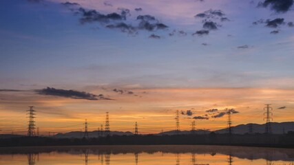 Wall Mural - beautiful sunrise, time lapses near huai ped reservoir, and high voltage transmission lines thailand