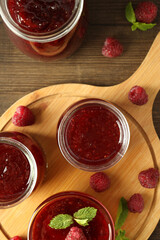 Wall Mural - Concept of tasty food with raspberry jam on wooden background