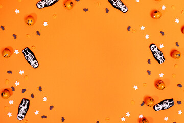 Wall Mural - Orange background with skull ghosts and pumpkins (Halloween background)