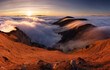 © TTstudio - Colorfull sunset behind Mountain peak landscape above clouds - panorama