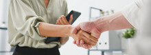 Young Creative People In Smart Casual Wear Discussing Business Shaking Hands Together In Office. Partner Cooperation, Coworker Teamwork Concept. Panoramic Banner Background With Copy Space.