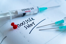 Third Covid Vaccine Dose And Jab Concept. Three Syringes Are Seen On Calendar As A Concept For The 3rd Covid-19 Vaccine Dose, Also Called Booster Shot, Now Requested During The Vaccination Campaign.