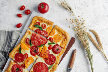 Wall Mural - Delicious homemade square pizza with vegetables on white