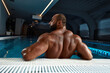 © Georgii - Portrait Of A Wet Sexy Muscular Man Standing In Swimming Pool