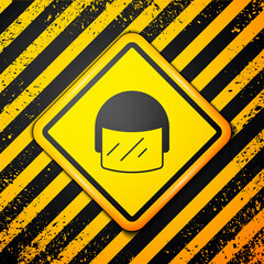 Sticker - Black Police helmet icon isolated on yellow background. Military helmet. Warning sign. Vector