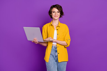 Poster - Photo of pretty sweet young woman dressed yellow shirt glasses typing modern device isolated purple color background