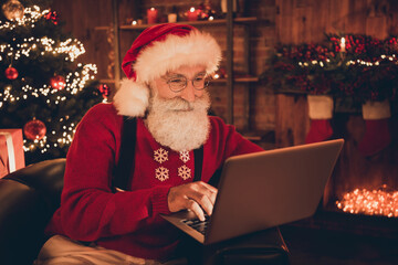 Poster - Photo of pretty cute age santa claus wear red costume typing modern gadget smiling indoors house room