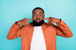 Photo of young black man pouted cheeks hold breath childish playful isolated over teal color background